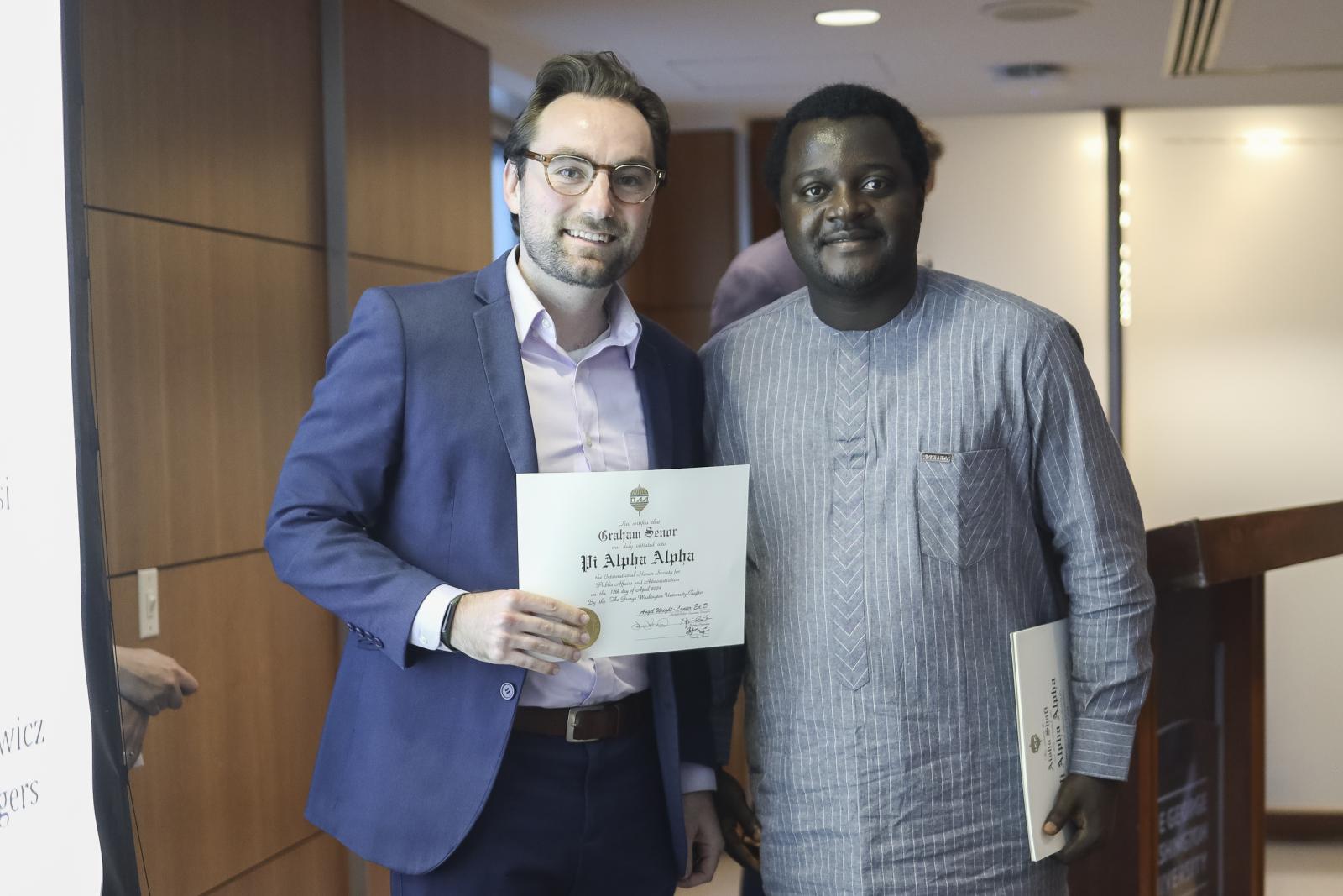 A student receiving his award on stage